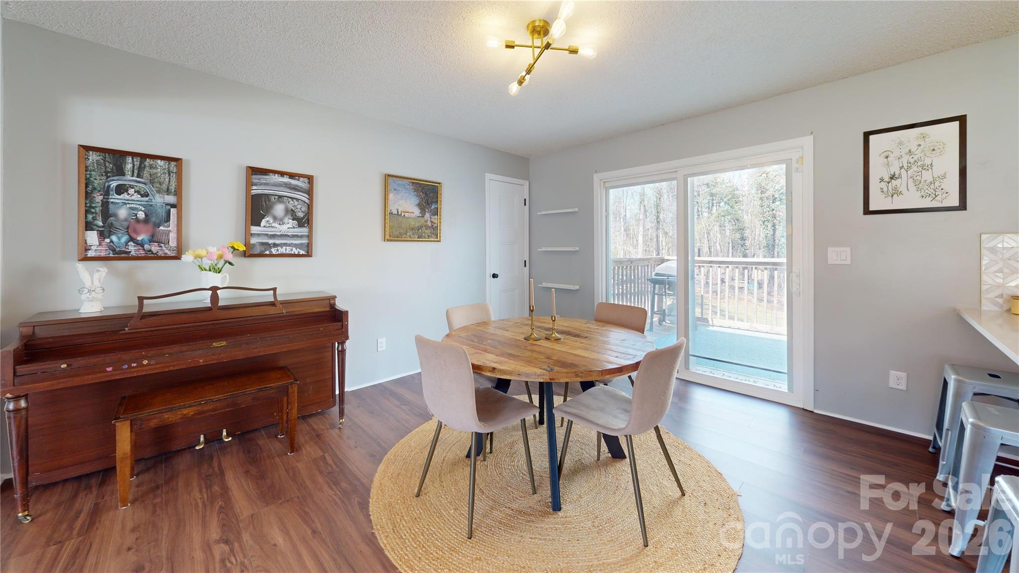 2992 Greenleaf Road Clover, SC 29710 - Photo 12 of 34 a view of a dining room with furniture and wooden floor
