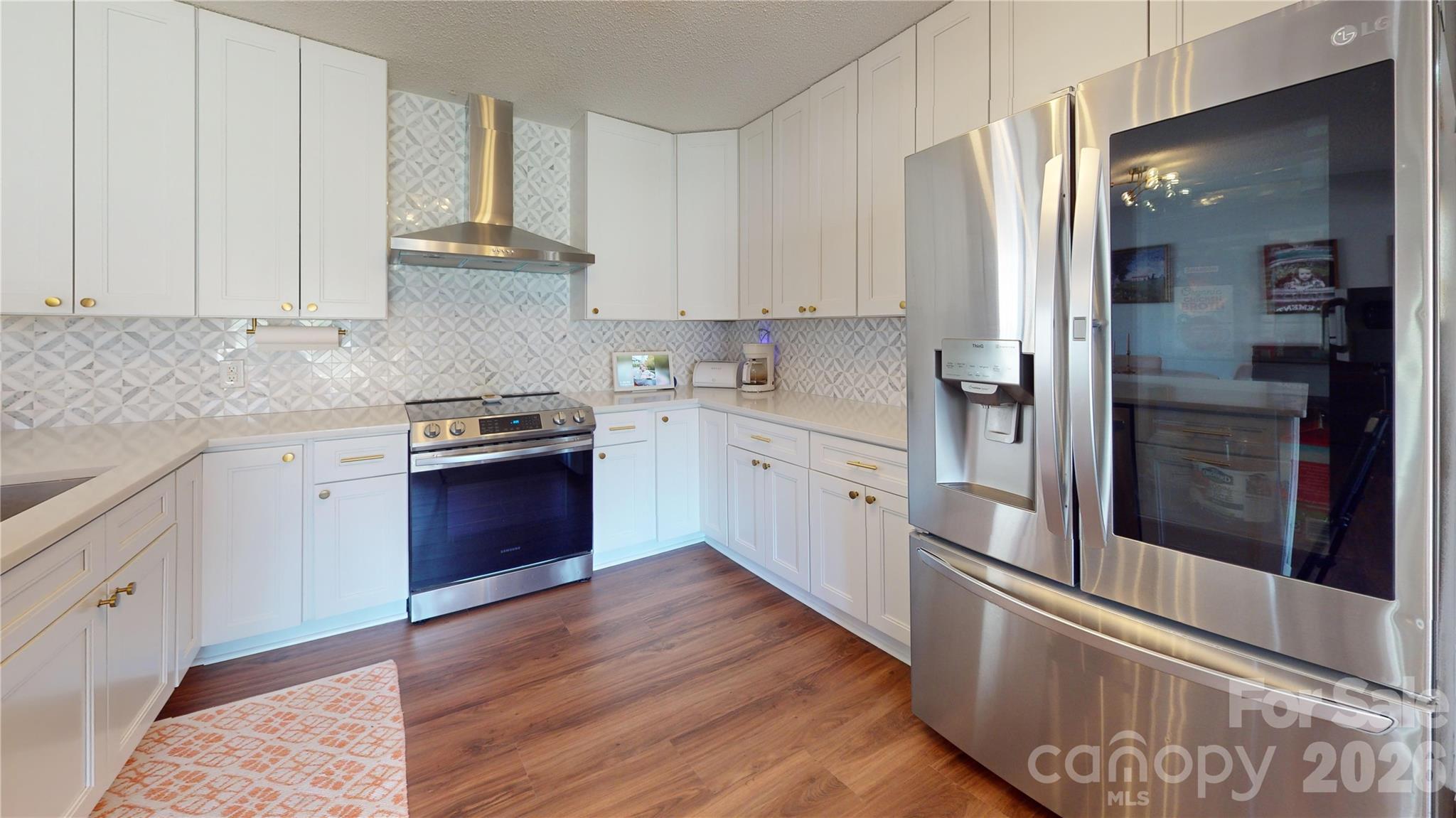 2992 Greenleaf Road Clover, SC 29710 - Photo 5 of 34 a kitchen with stainless steel appliances granite countertop a refrigerator and a stove