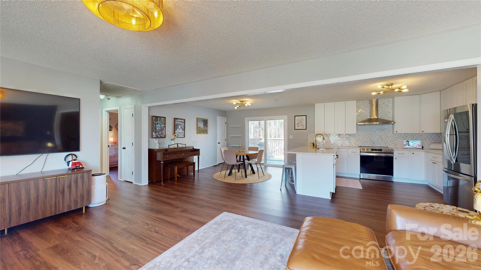 2992 Greenleaf Road Clover, SC 29710 - Photo 6 of 34 a living room with fireplace furniture and a flat screen tv