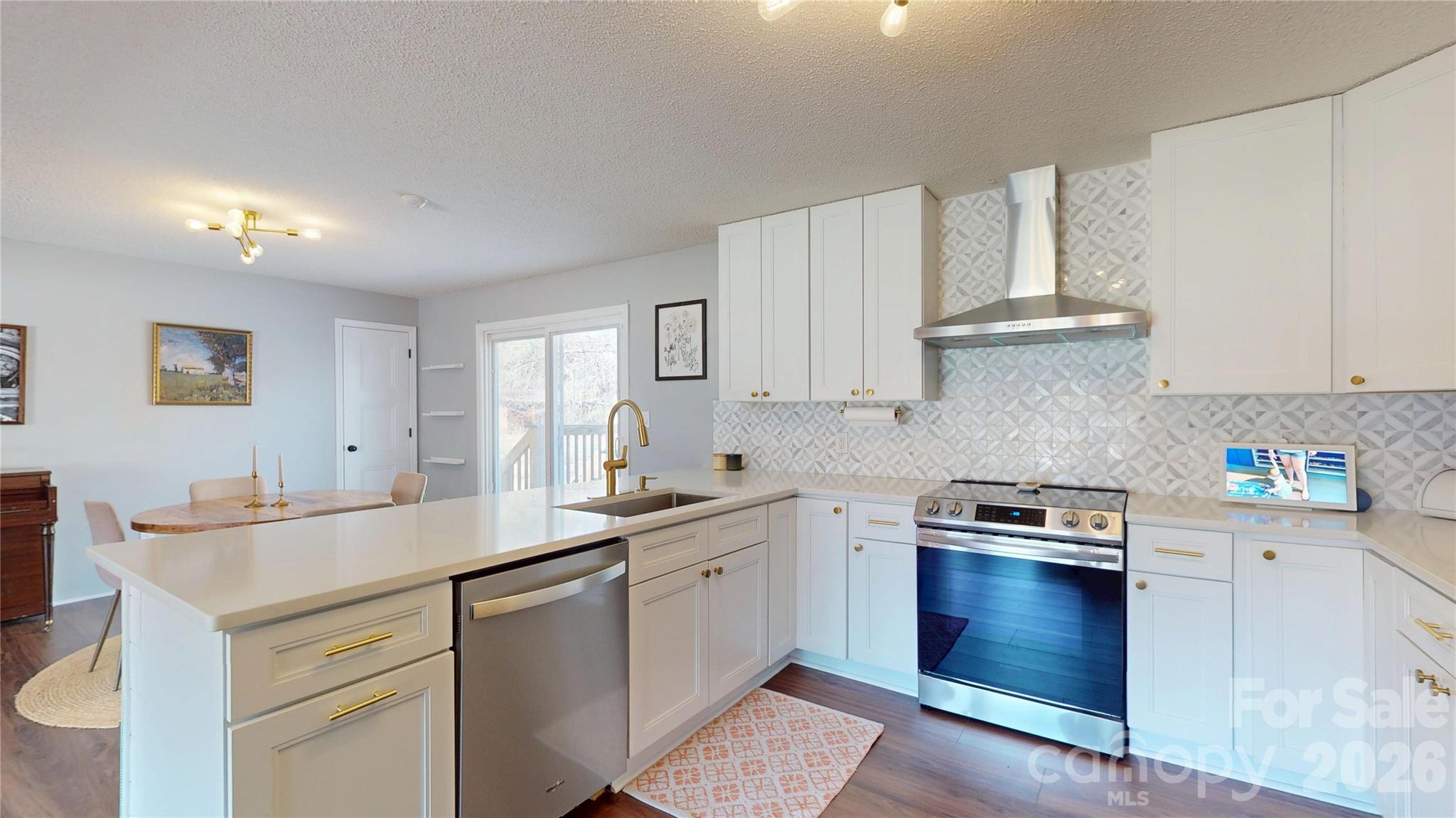 2992 Greenleaf Road Clover, SC 29710 - Photo 8 of 34 a kitchen with stainless steel appliances granite countertop a sink stove and cabinets