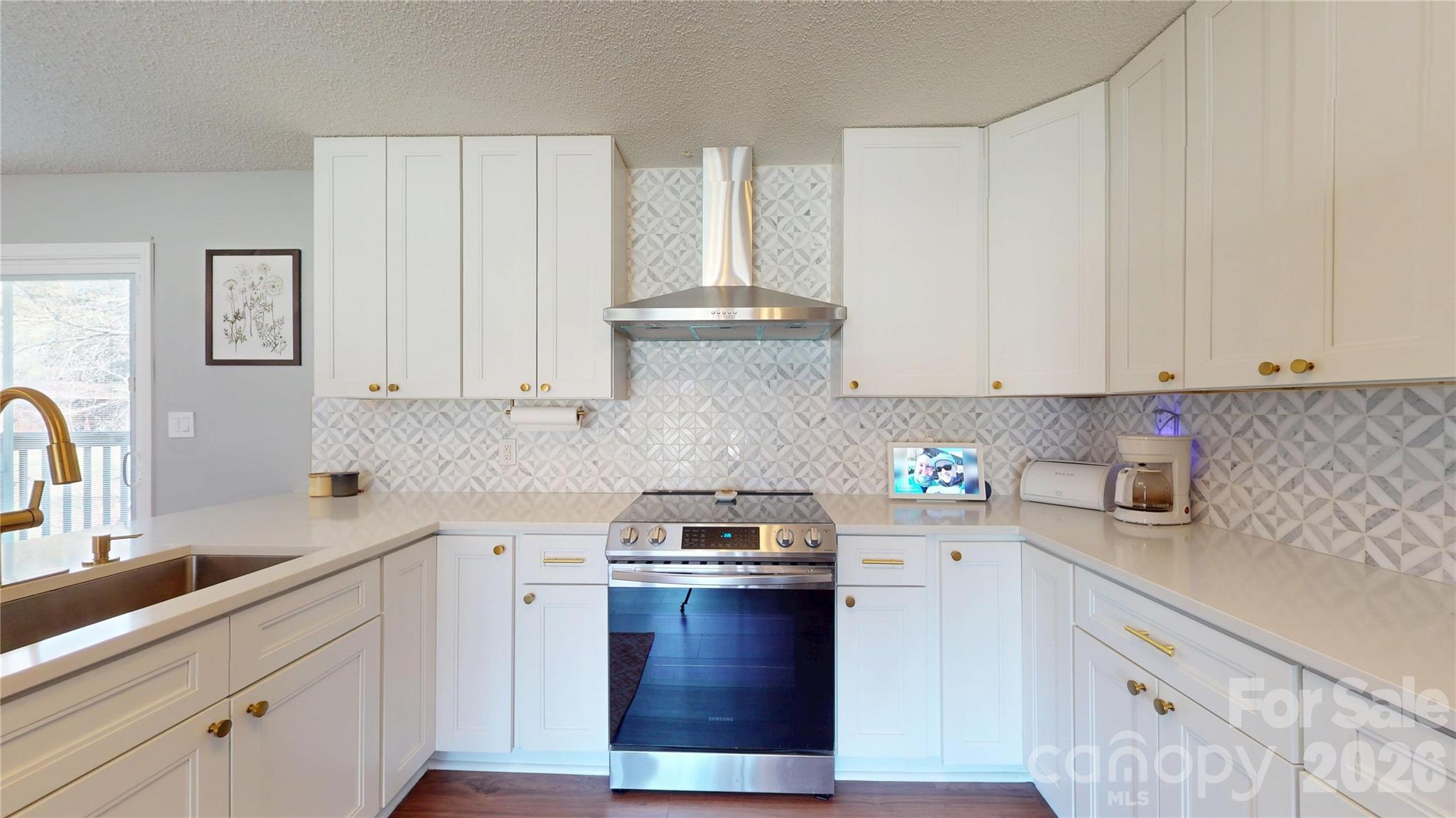 2992 Greenleaf Road Clover, SC 29710 - Photo 9 of 34 a kitchen with stainless steel appliances granite countertop a sink stove and cabinets