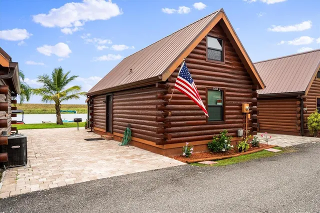 a view of a house with a yard and garage