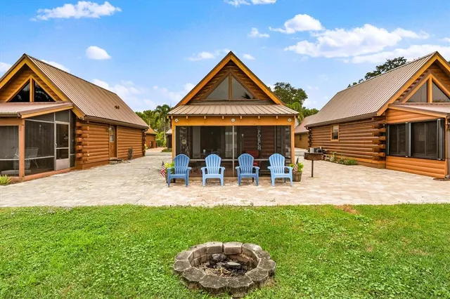 a front view of a house with a yard and patio