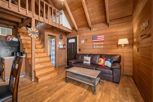 a patio with a table and chairs and a barbeque