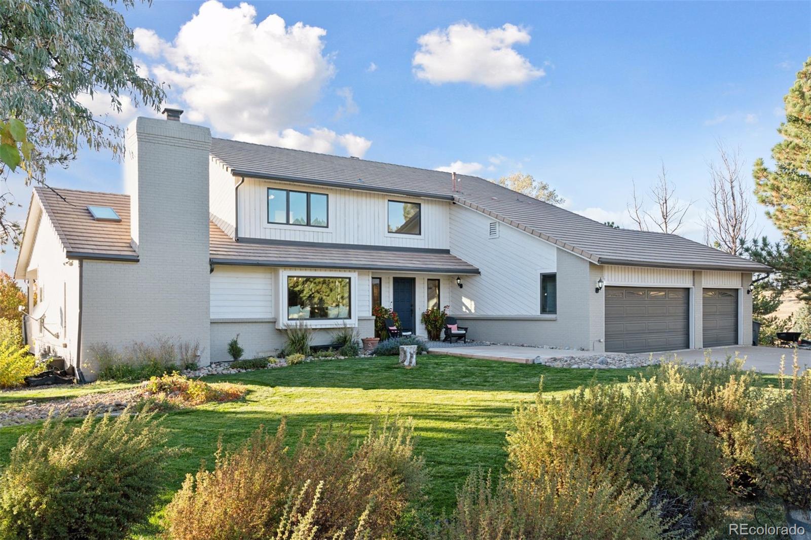 a front view of a house with swimming pool having outdoor seating