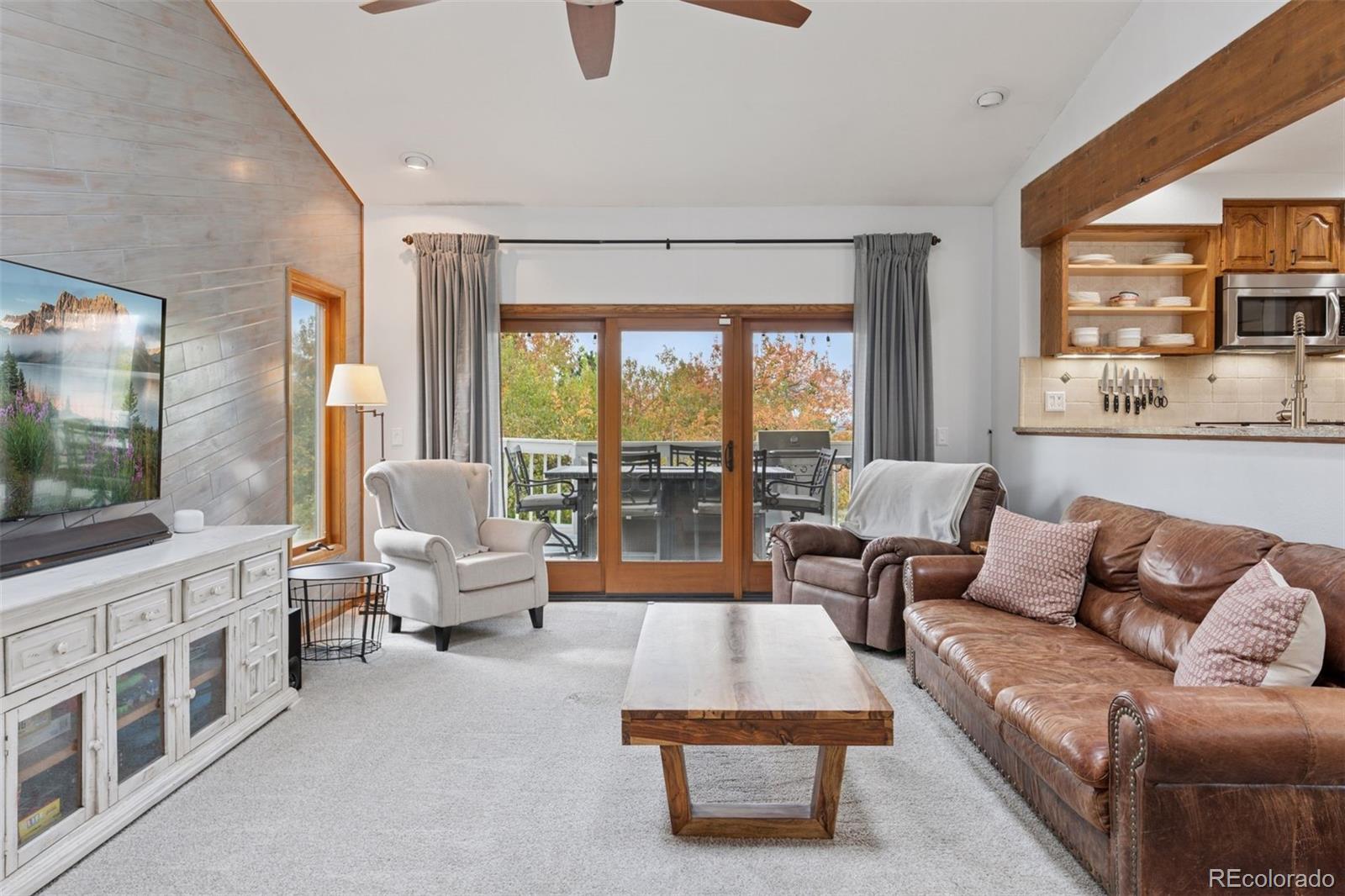 7501 Stroh Road Parker, CO 80134 - Photo 13 of 49 a living room with furniture and a large window