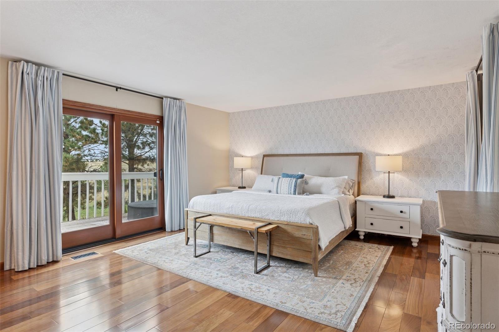 7501 Stroh Road Parker, CO 80134 - Photo 18 of 49 a bed room with a bed and a large window