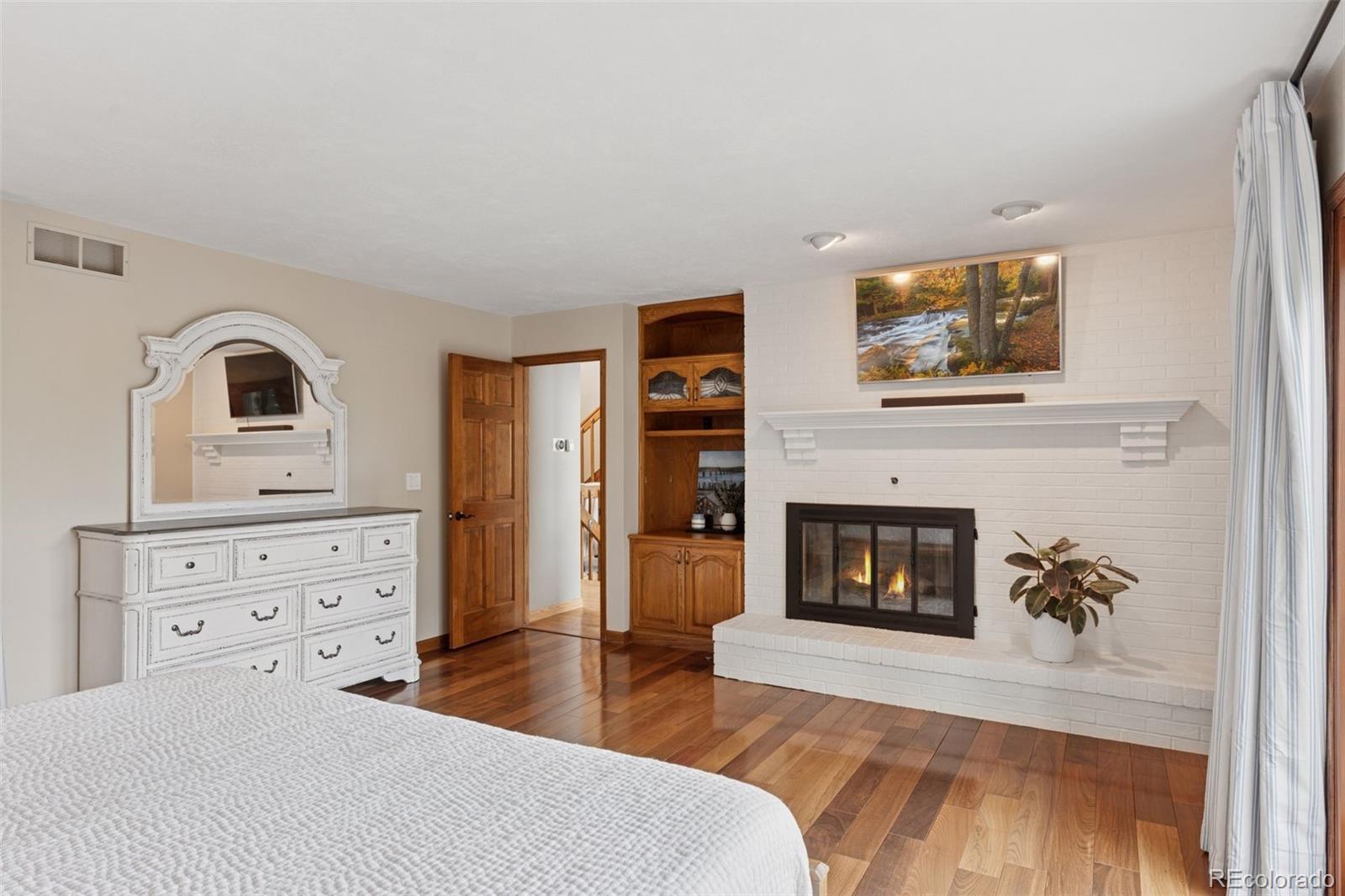 7501 Stroh Road Parker, CO 80134 - Photo 19 of 49 a living room with furniture and a fireplace