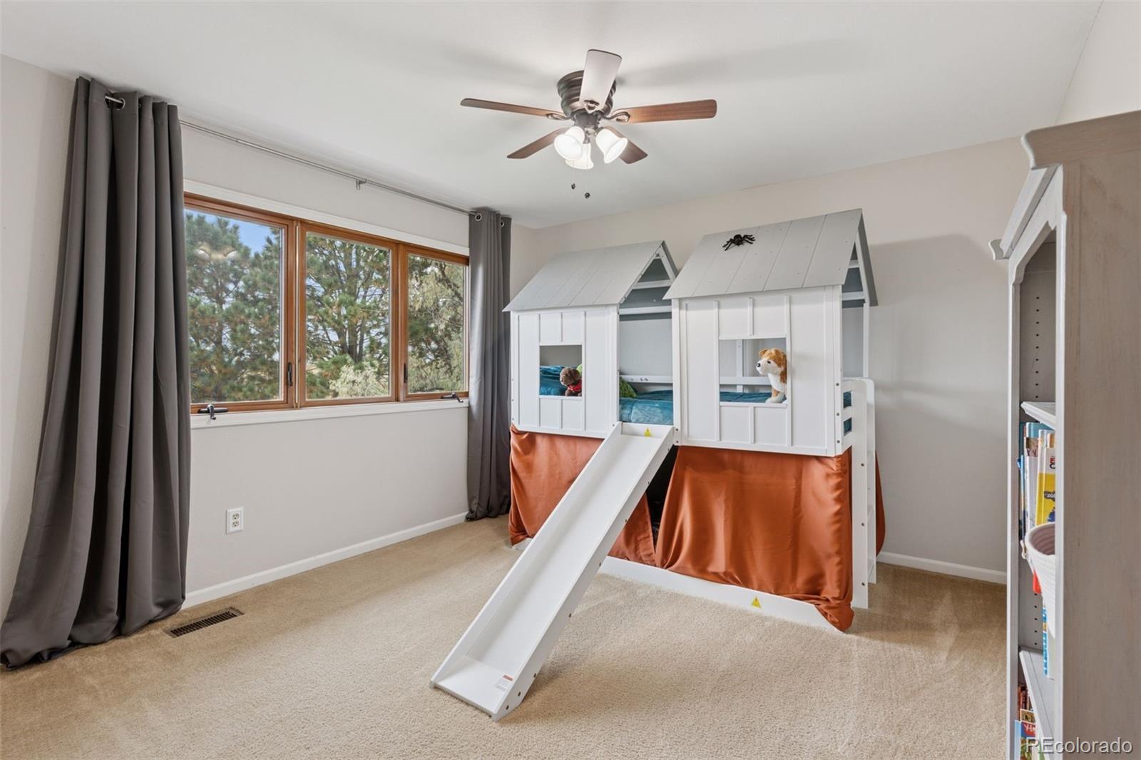 7501 Stroh Road Parker, CO 80134 - Photo 29 of 49 a living room with stainless steel appliances furniture and a large window