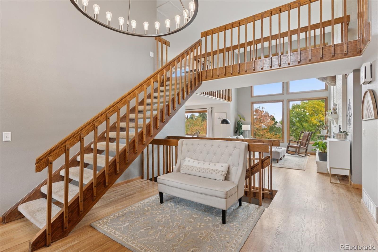 7501 Stroh Road Parker, CO 80134 - Photo 3 of 49 a view of entryway and hall with wooden floor