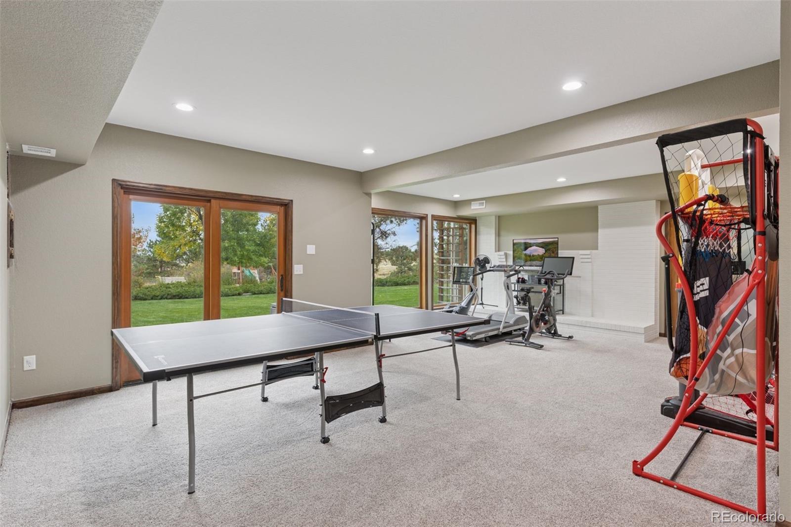 7501 Stroh Road Parker, CO 80134 - Photo 34 of 49 a room with lots of furniture and windows