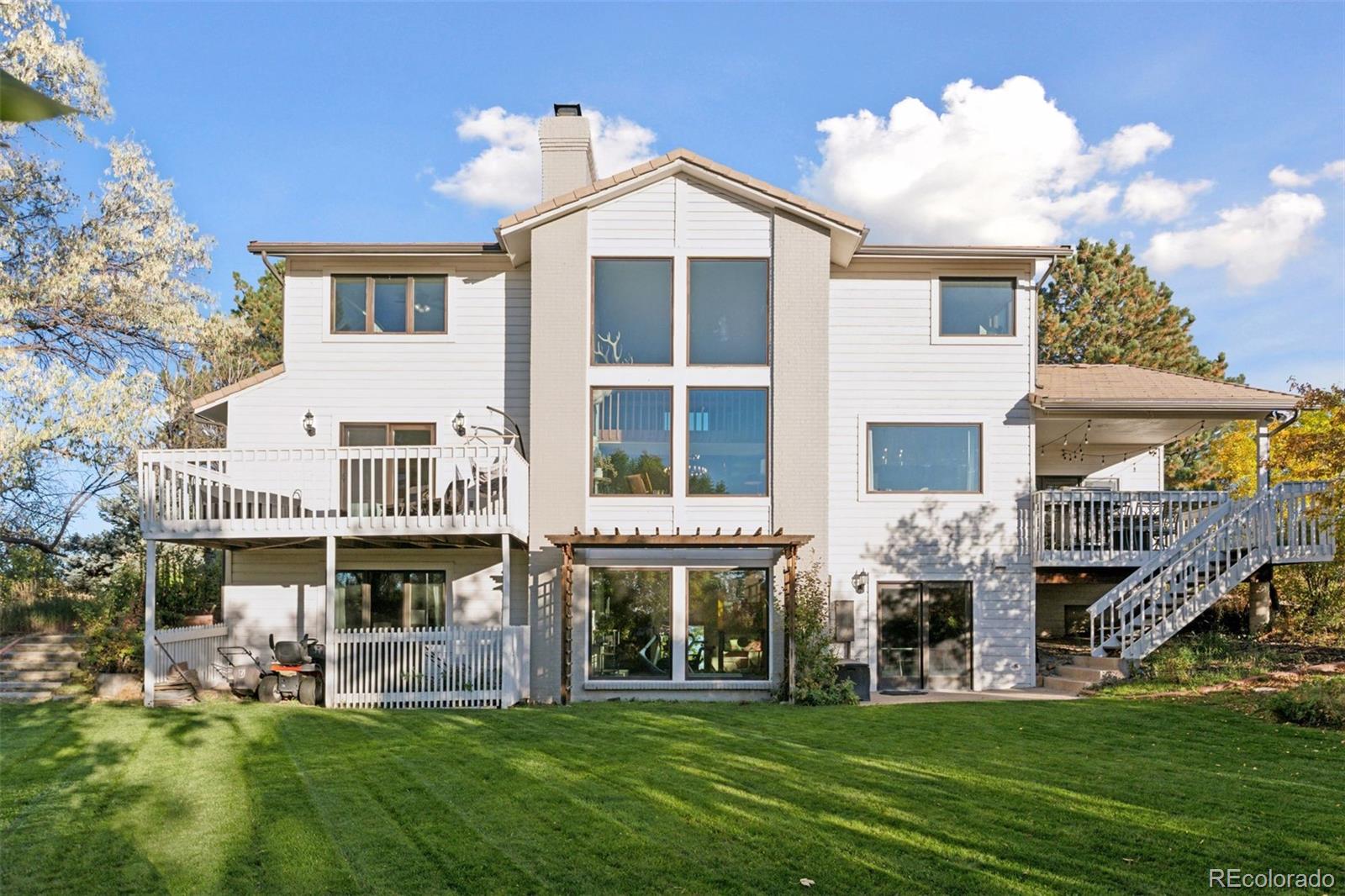 7501 Stroh Road Parker, CO 80134 - Photo 37 of 49 a front view of a house with a yard