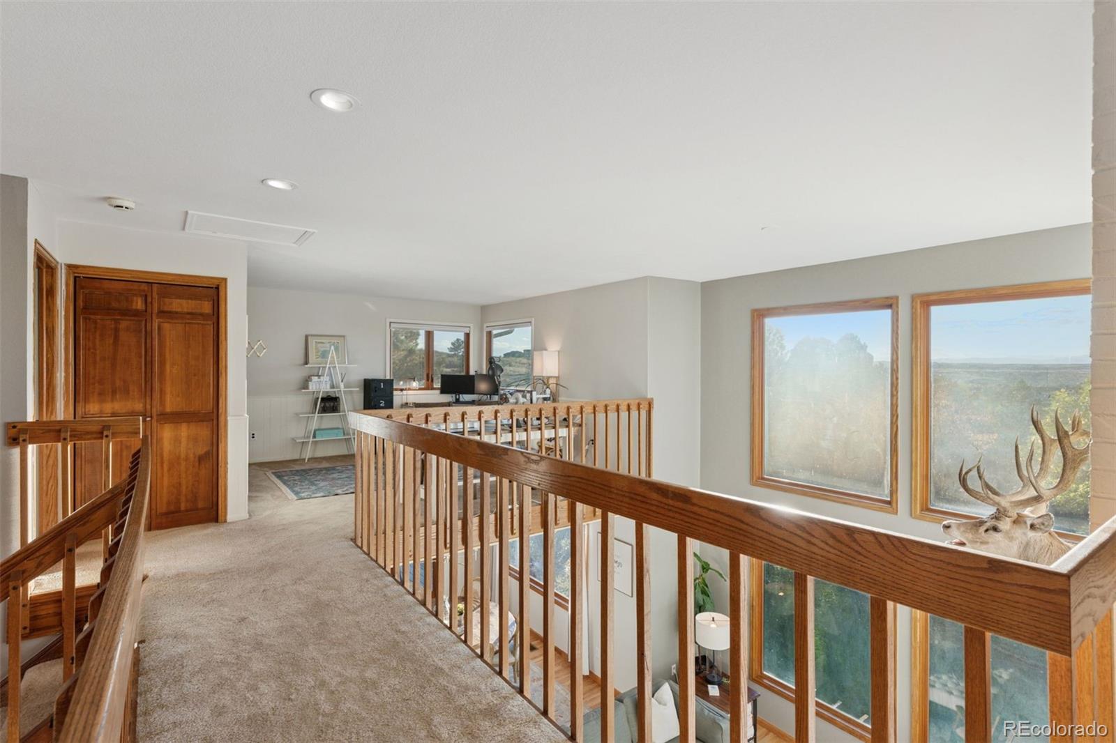 7501 Stroh Road Parker, CO 80134 - Photo 41 of 49 a view of a hallway with dining room and chandelier