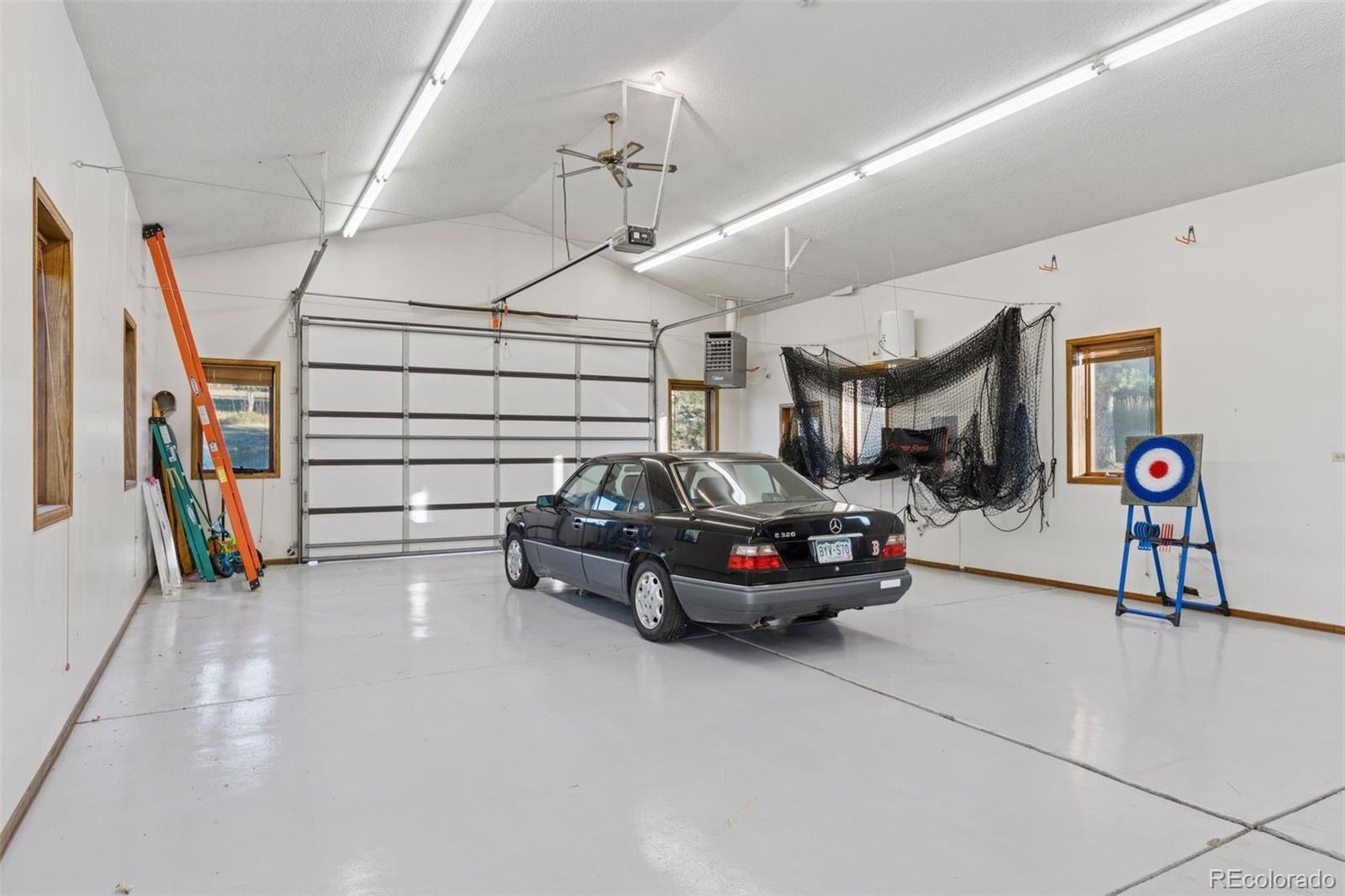 7501 Stroh Road Parker, CO 80134 - Photo 43 of 49 a car parked in a garage