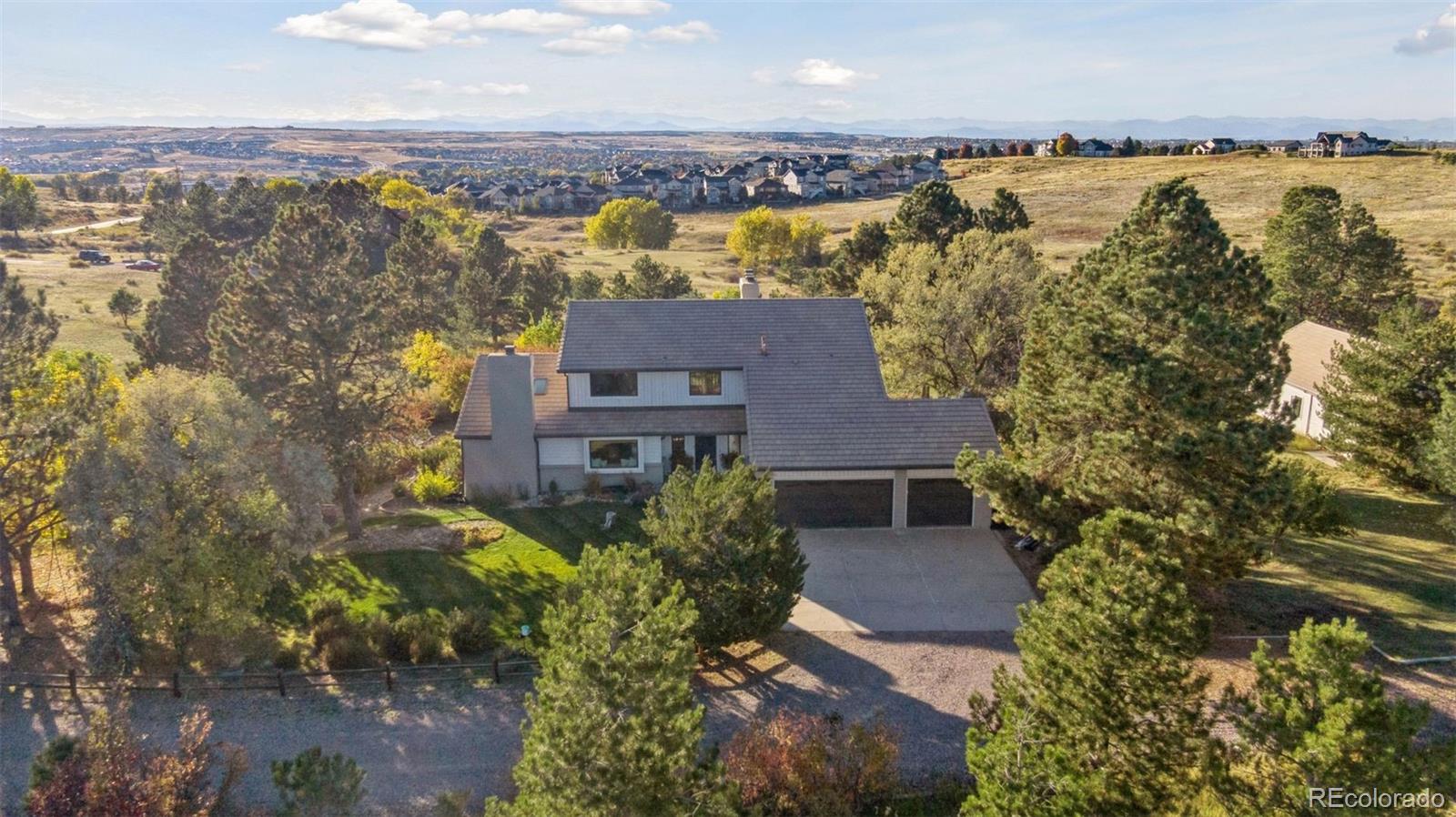 7501 Stroh Road Parker, CO 80134 - Photo 45 of 49 an aerial view of residential houses with outdoor space and trees