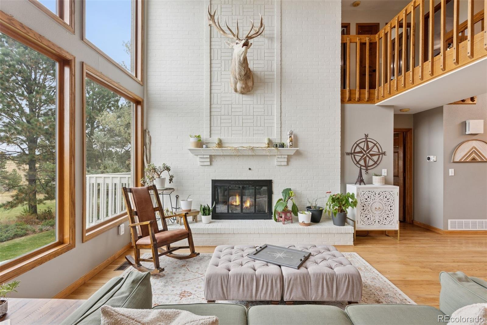 7501 Stroh Road Parker, CO 80134 - Photo 5 of 49 a living room with furniture fireplace and flat screen tv