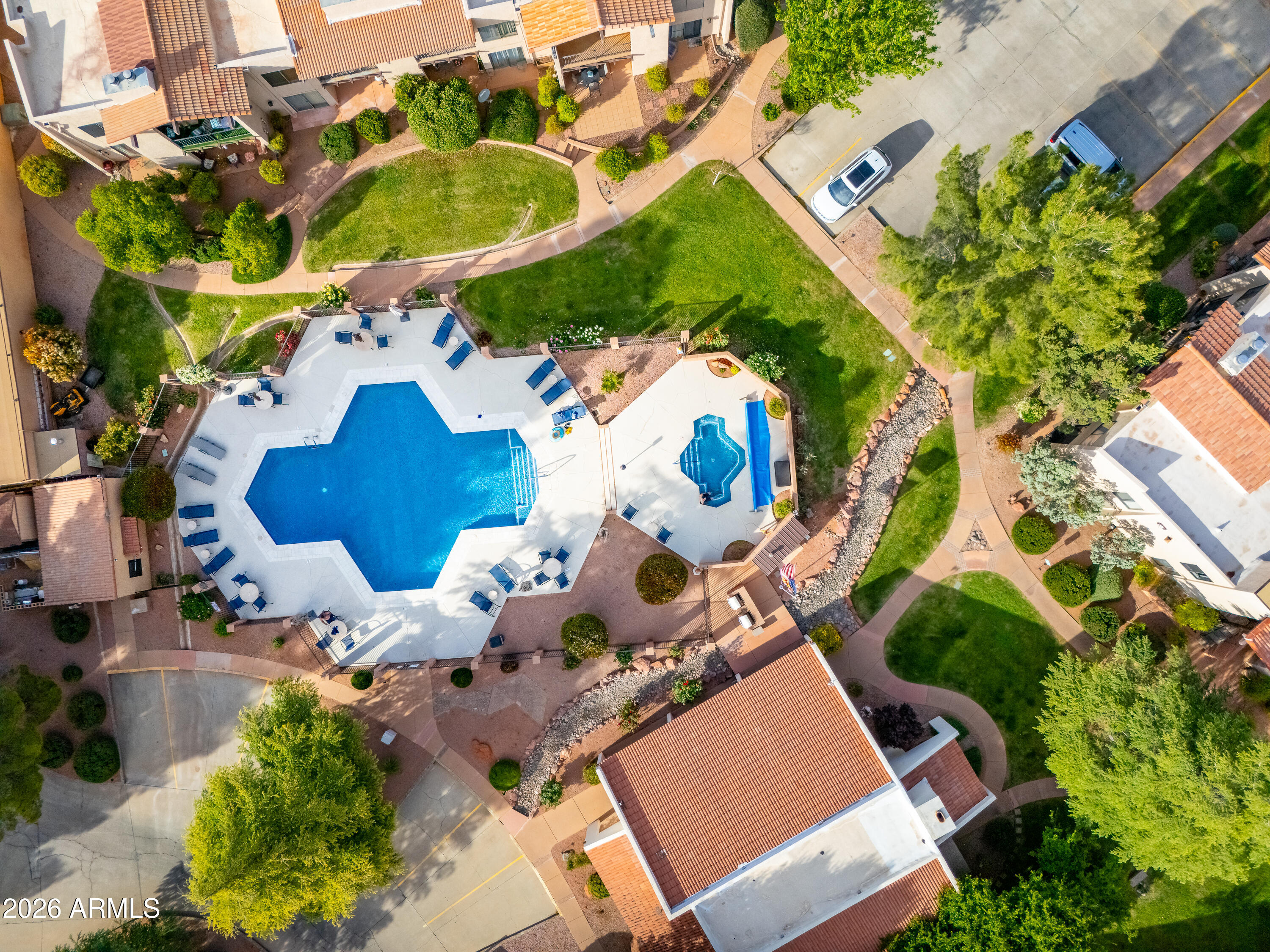 65 Verde Valley School Road, Unit D15 Sedona, AZ 86351 - Photo 24 of 27 an aerial view of a house with a yard and garden