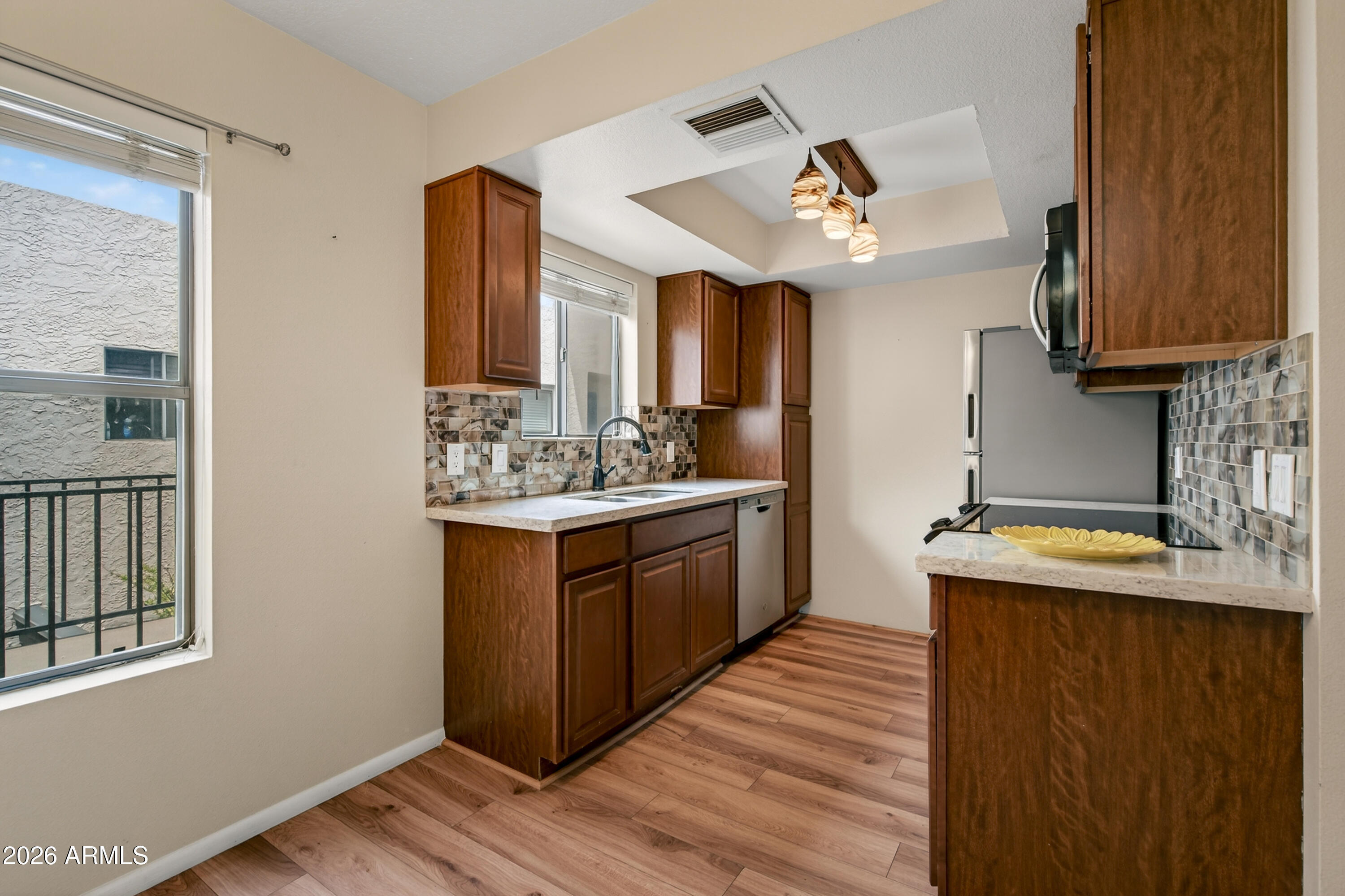 65 Verde Valley School Road, Unit D15 Sedona, AZ 86351 - Photo 6 of 27 a kitchen with a sink appliances and cabinets