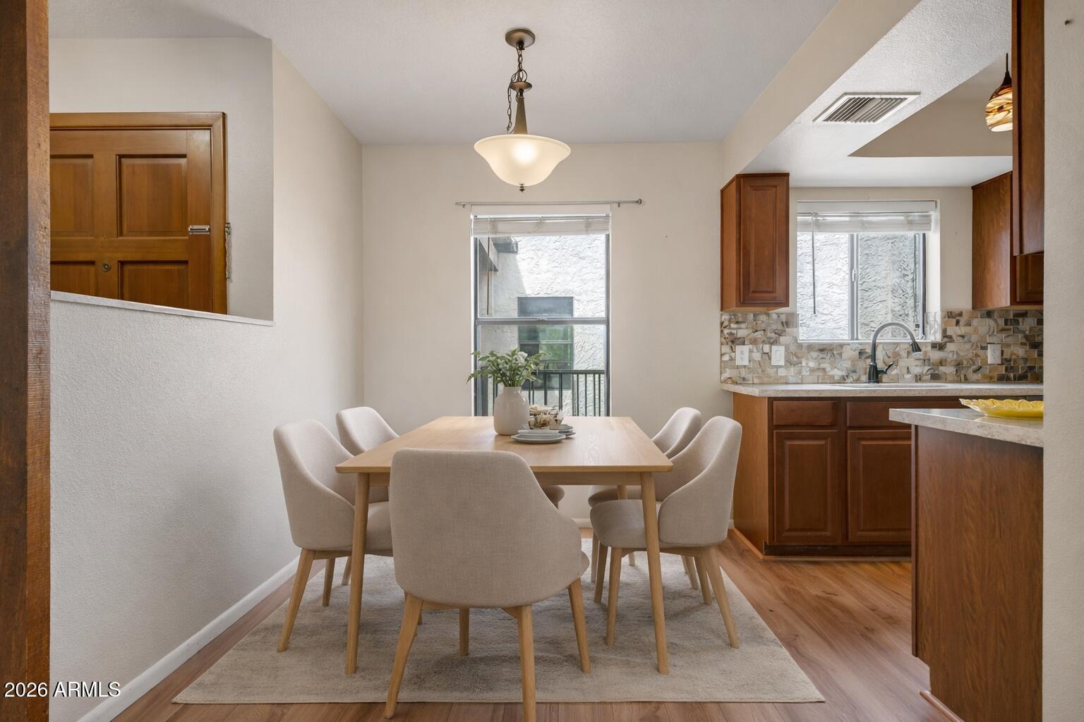 65 Verde Valley School Road, Unit D15 Sedona, AZ 86351 - Photo 8 of 27 a view of a dining room with furniture and window