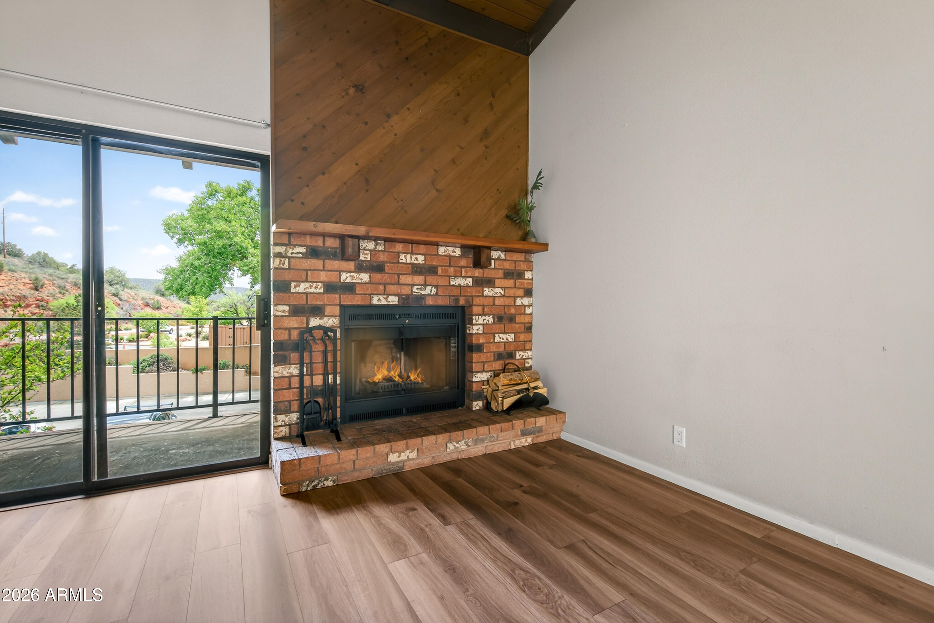 65 Verde Valley School Road, Unit D15 Sedona, AZ 86351 - Photo 9 of 27 a living room with a fireplace