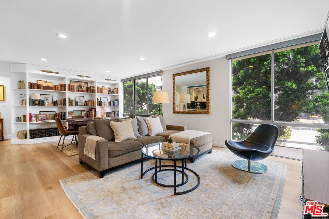 2160 Century Park East, Unit 211 Los Angeles, CA 90067 - Photo 1 of 24 a living room with furniture and a large window