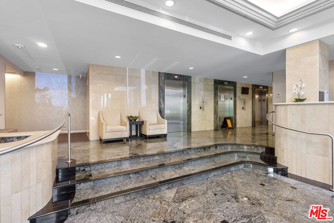 2160 Century Park East, Unit 211 Los Angeles, CA 90067 - Photo 21 of 24 a large white bathroom with sink and mirror