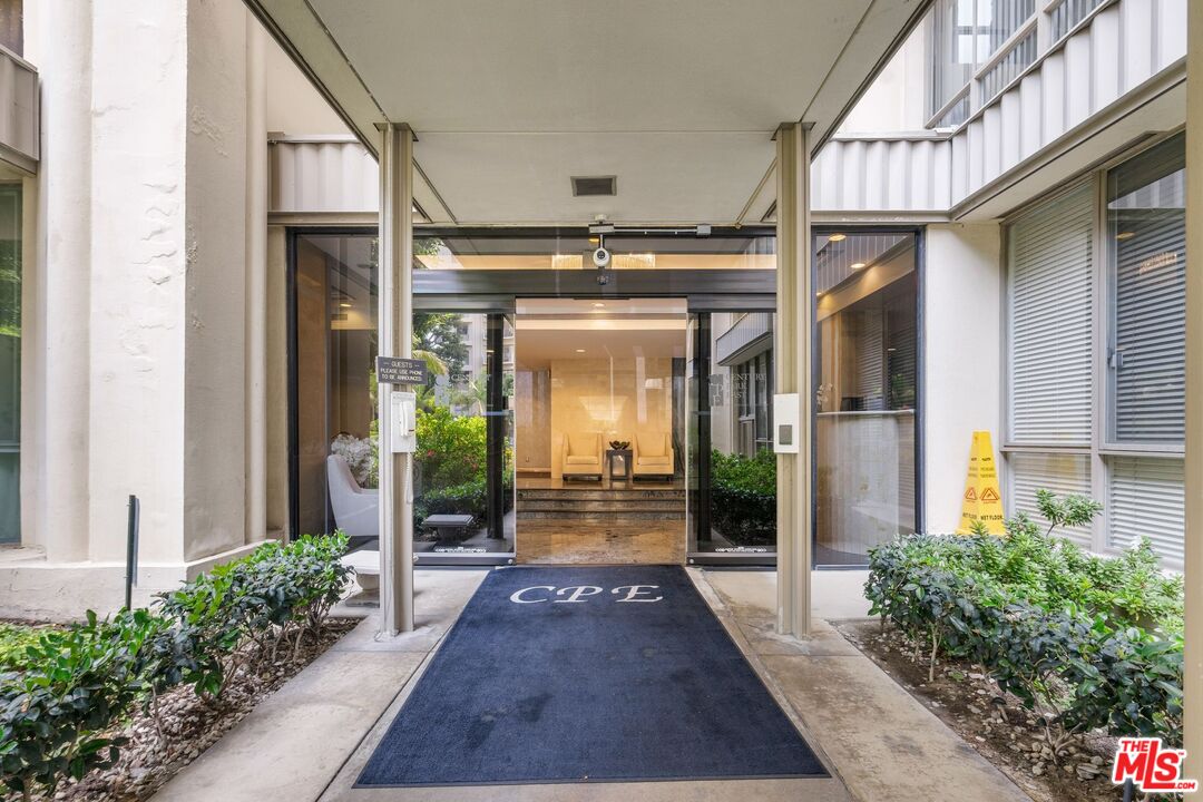2160 Century Park East, Unit 211 Los Angeles, CA 90067 - Photo 22 of 24 a view of a pathway of a house with porch
