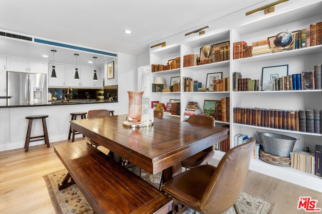 2160 Century Park East, Unit 211 Los Angeles, CA 90067 - Photo 10 of 24 a living room with furniture and a book shelf