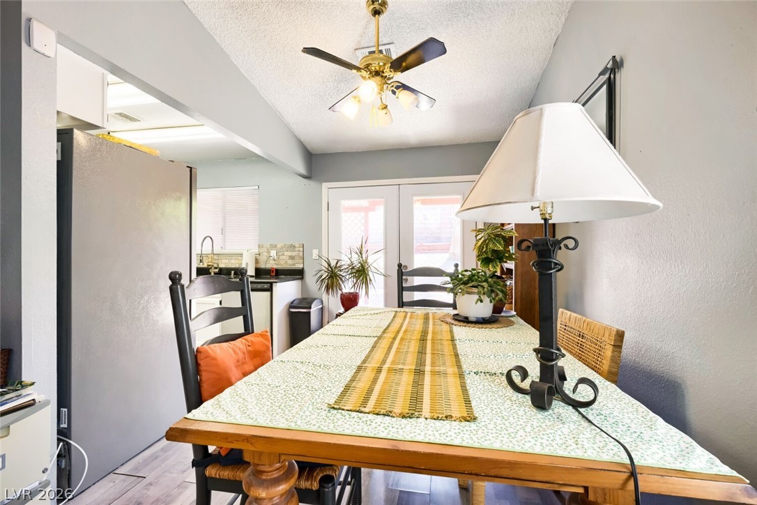 2322 Sabroso Street Las Vegas, NV 89156 - Photo 6 of 17 A welcoming dining area boasts doors leading to outdoor area.