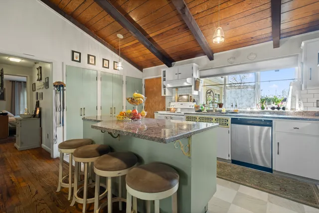 a kitchen with a table and chairs