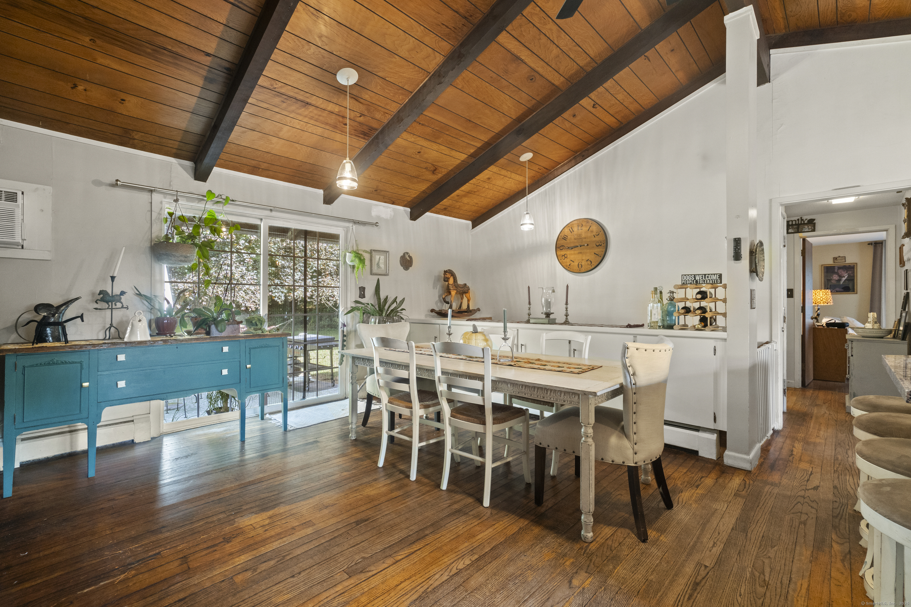 92 Minortown Road Woodbury, CT 06798 - Photo 13 of 40 a view of a dining room with furniture and wooden floor
