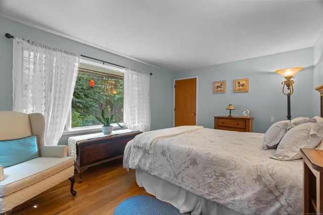 a bedroom with a bed and a couch