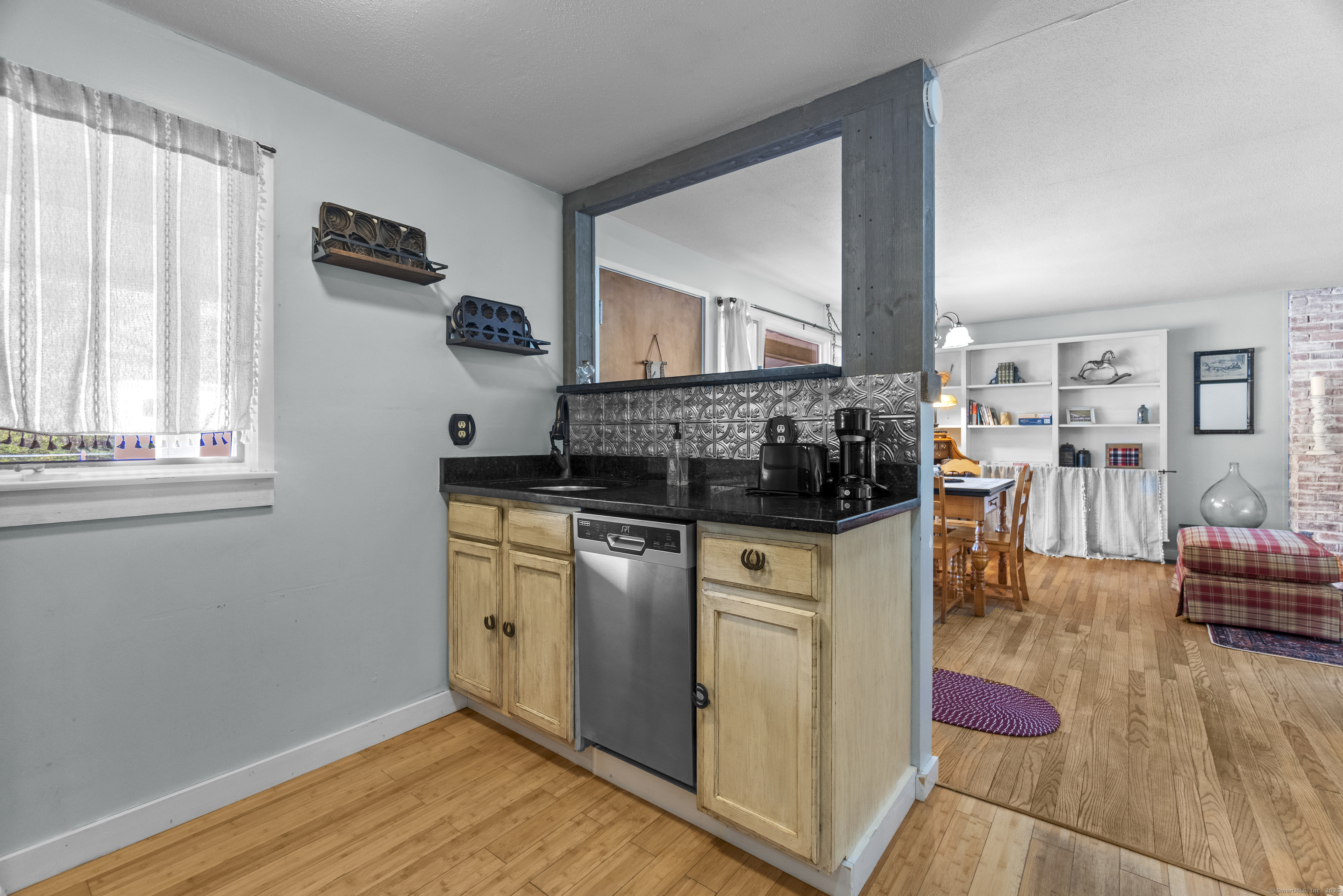 92 Minortown Road Woodbury, CT 06798 - Photo 26 of 40 a kitchen with stainless steel appliances granite countertop a stove a sink and a refrigerator