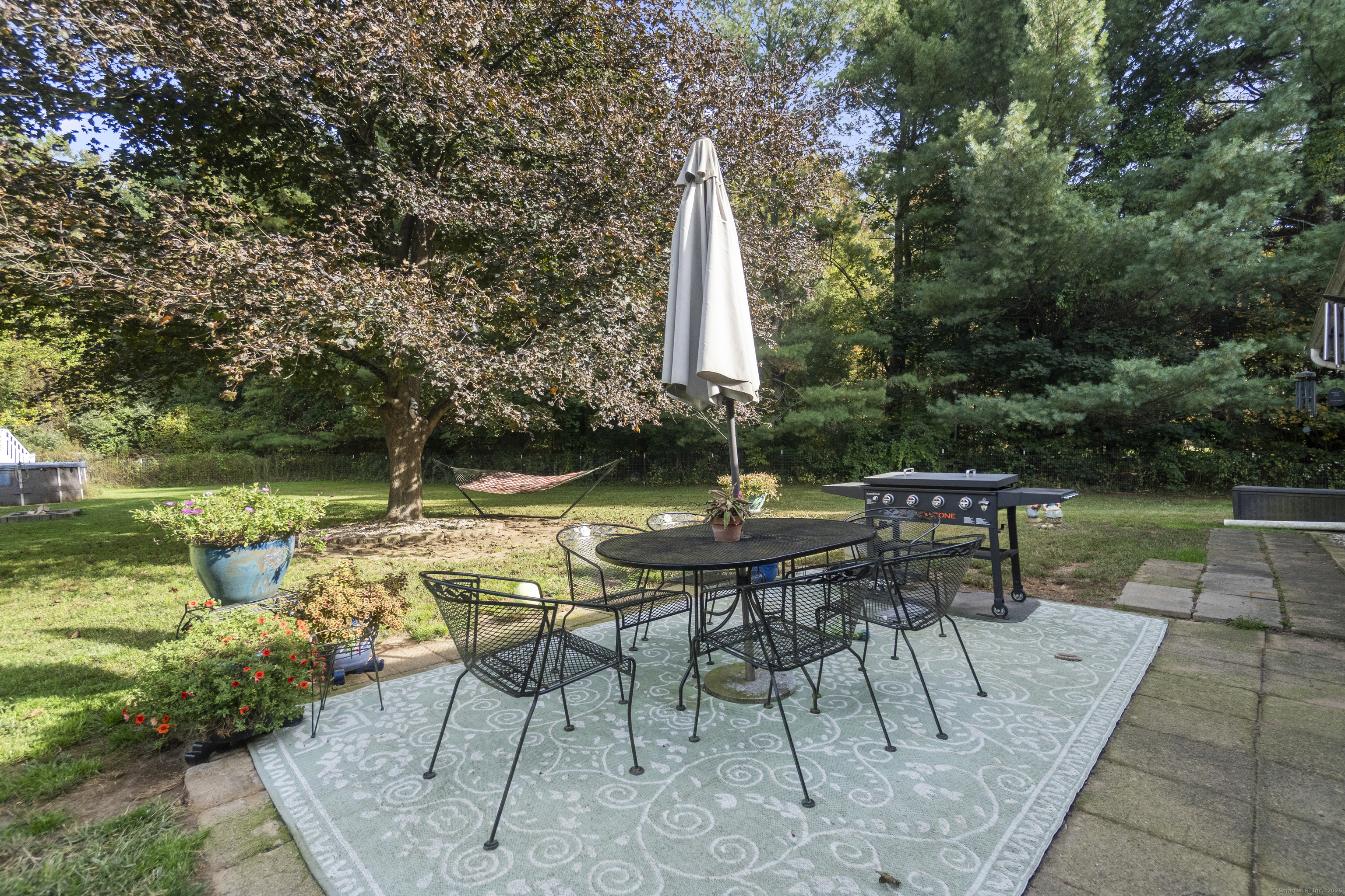 92 Minortown Road Woodbury, CT 06798 - Photo 30 of 40 a view of a tables and chairs in patio