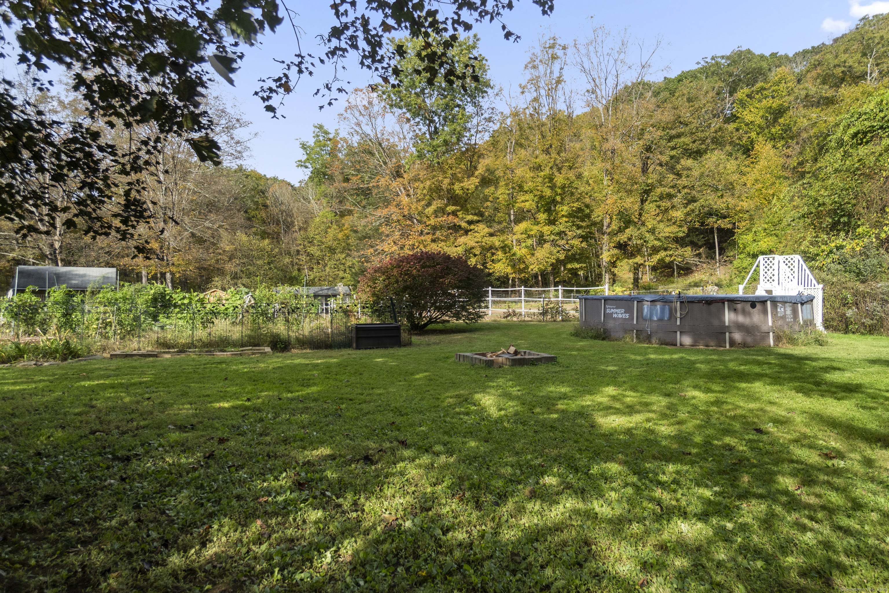 92 Minortown Road Woodbury, CT 06798 - Photo 32 of 40 a view of a house with a yard