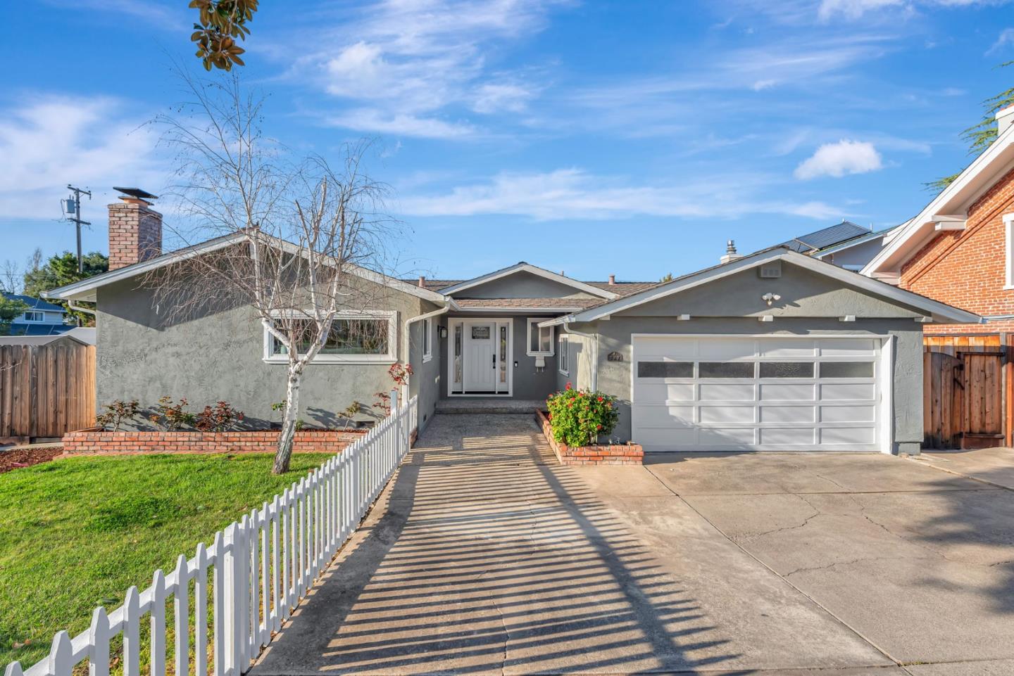 777 Cascade Drive Sunnyvale, CA 94087 - Photo 1 of 1 a front view of a house with a yard and potted plants
