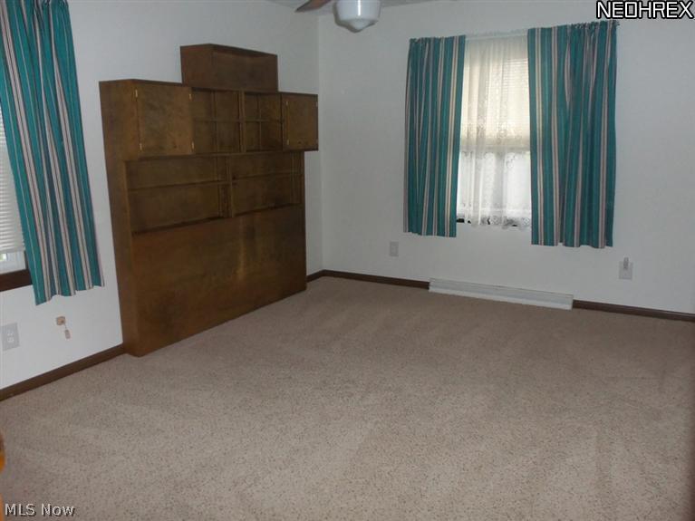 15640 Georgia Road Middlefield, OH 44062 - Photo 6 of 19 Master bedroom offers large double closet, full bath and has built in headboard...or can be removed to accomodate your own set...