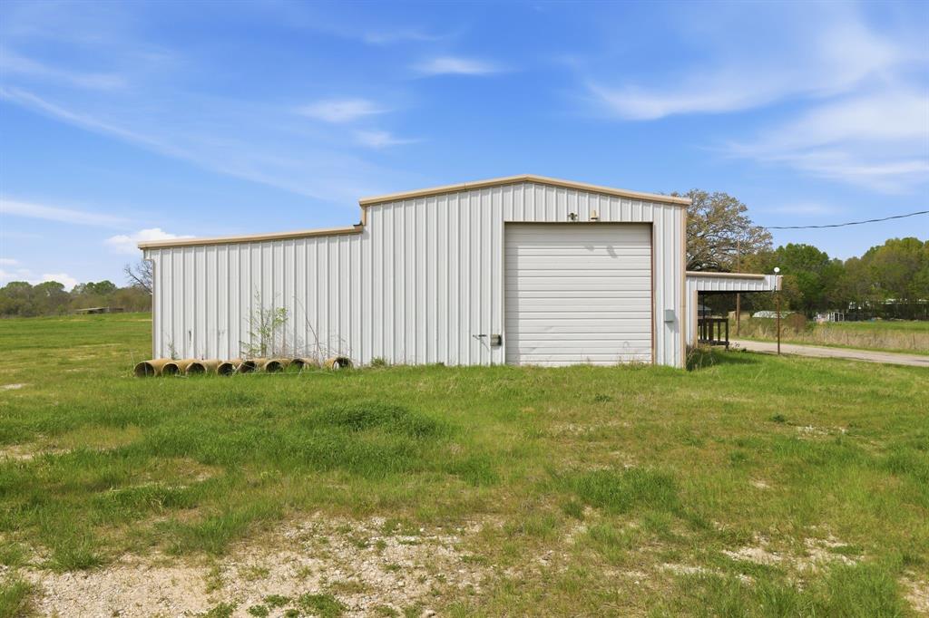641 Rscr 4480 Point Point, TX 75472 - Photo 21 of 40 a view of a backyard with barn plants