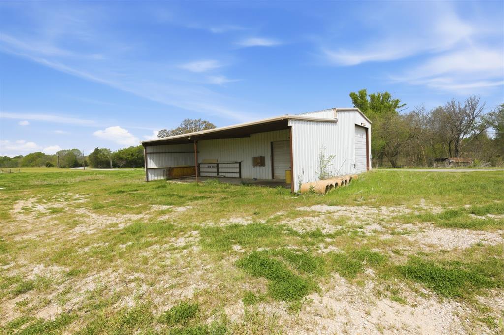 641 Rscr 4480 Point Point, TX 75472 - Photo 39 of 40 a backyard of a house with lots of green space and mountain view in the back