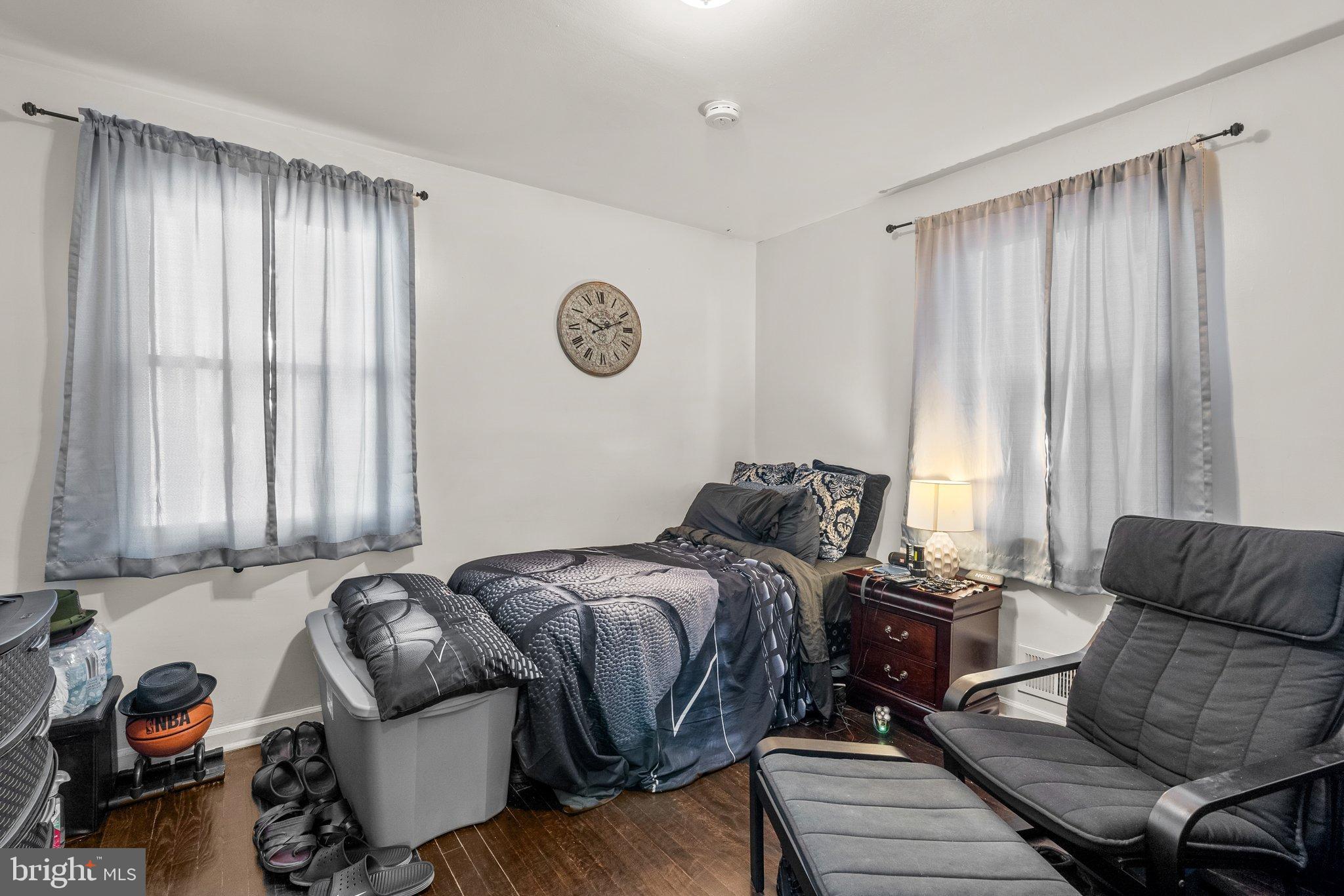 5122 Decatur Street Hyattsville, MD 20781 - Photo 11 of 22 a bedroom with furniture and a large window