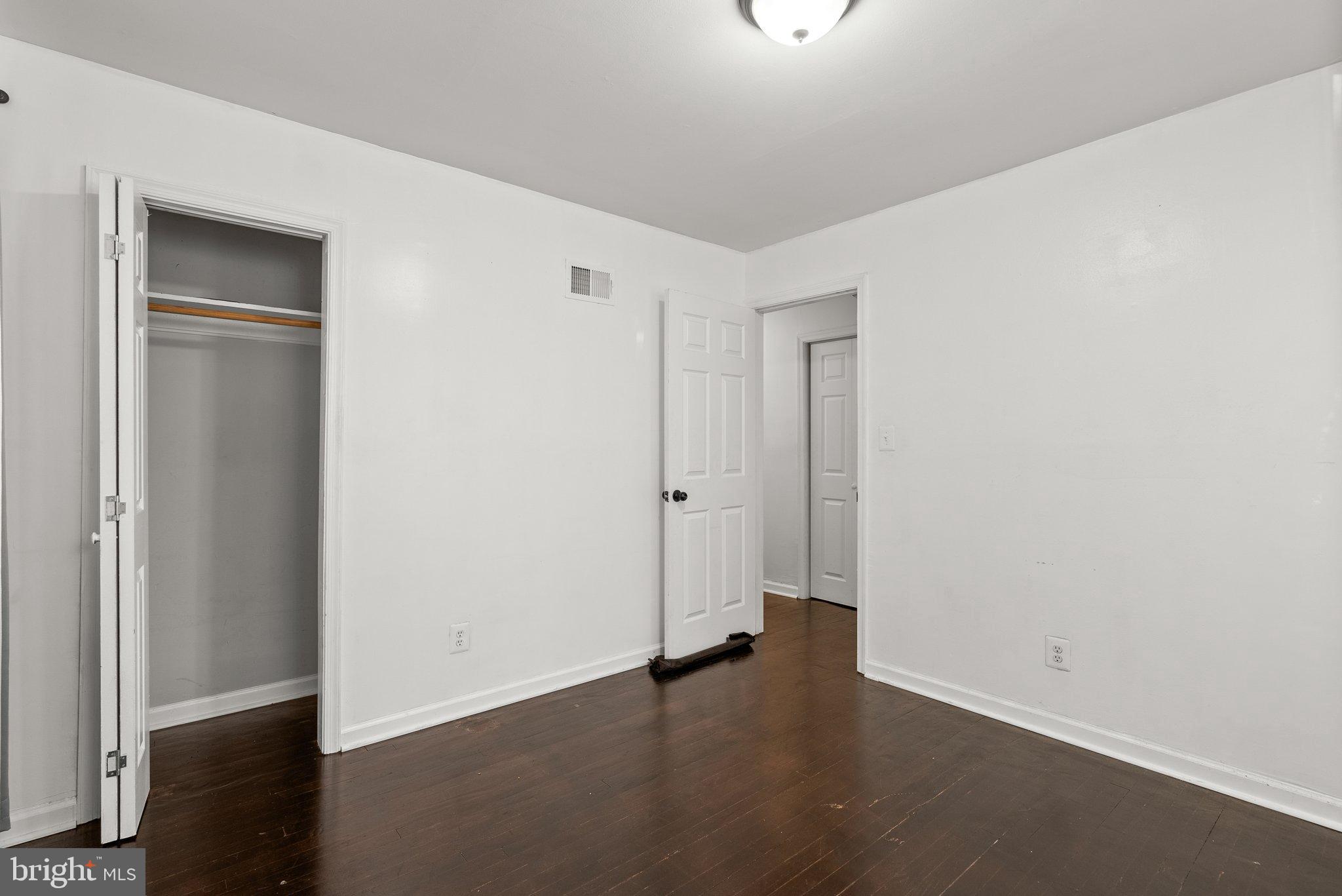 5122 Decatur Street Hyattsville, MD 20781 - Photo 13 of 22 an empty room with wooden floor and closet