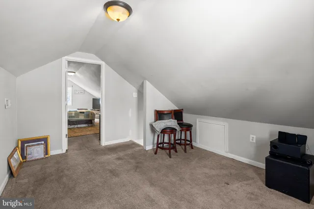 a view of livingroom with furniture and workspace