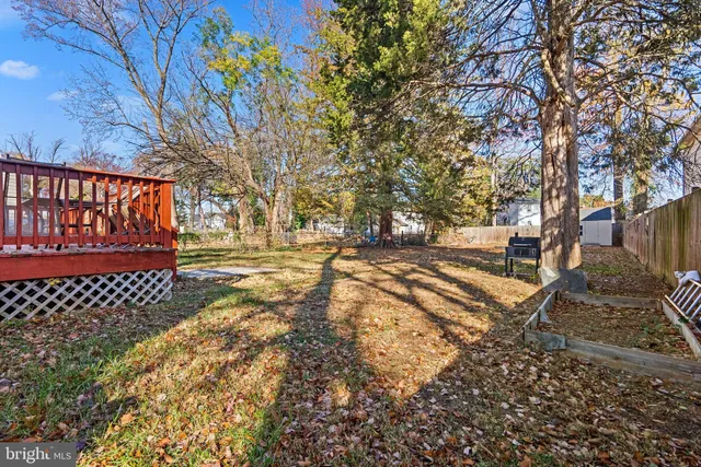 a view of street with wooden fence