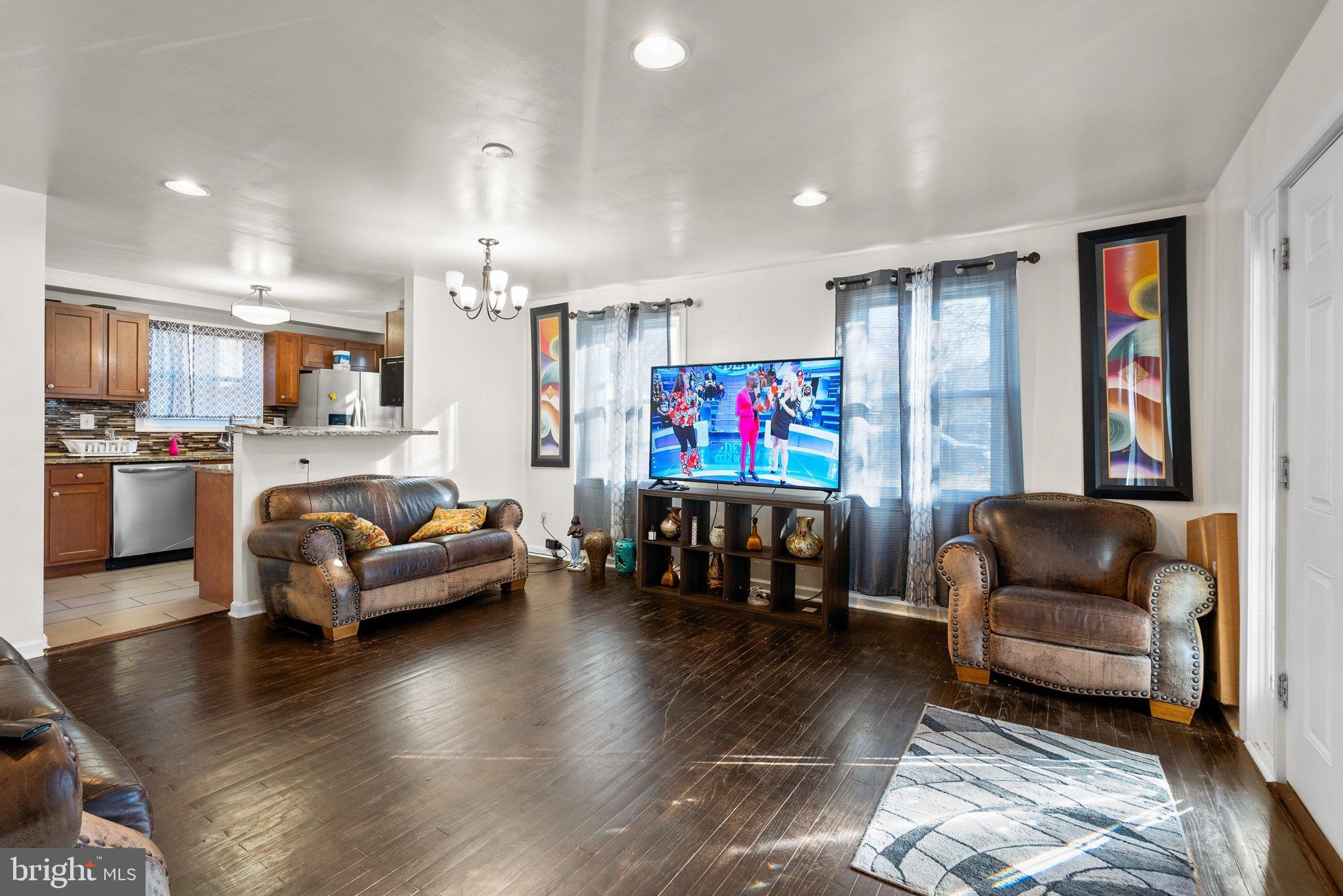 5122 Decatur Street Hyattsville, MD 20781 - Photo 3 of 22 a living room with furniture and a flat screen tv