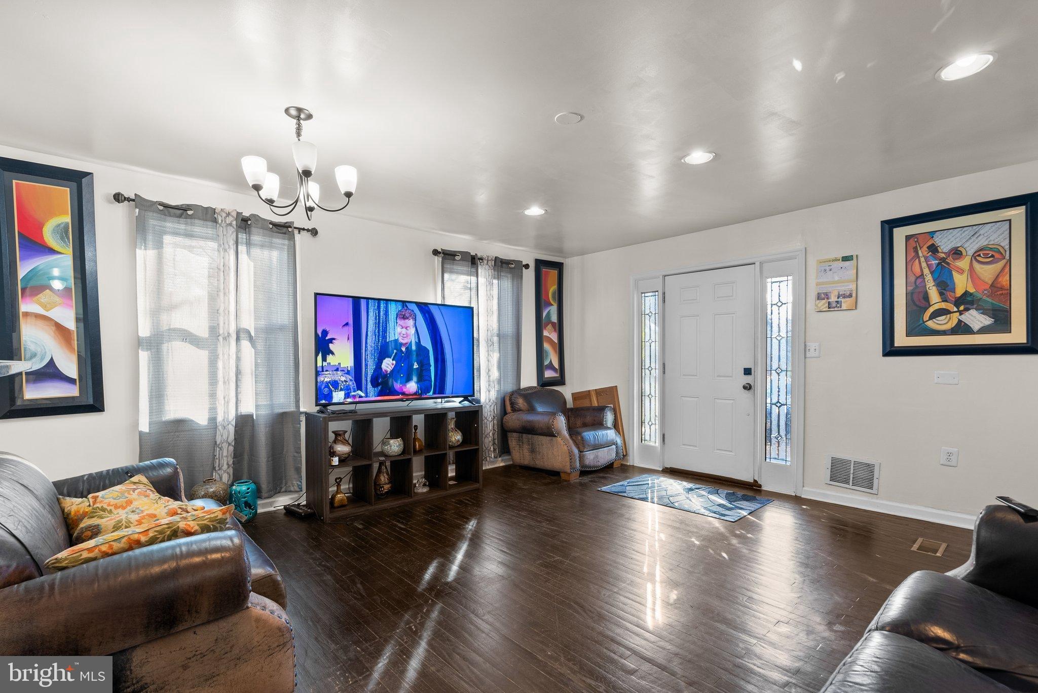 5122 Decatur Street Hyattsville, MD 20781 - Photo 4 of 22 a living room with furniture and a flat screen tv