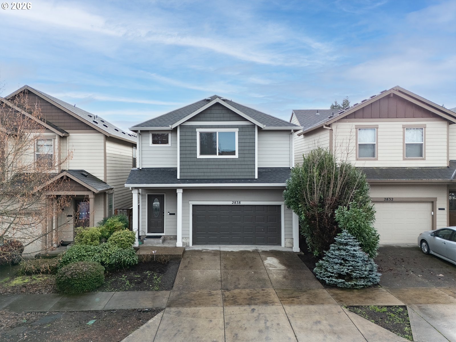 a front view of a house with garden