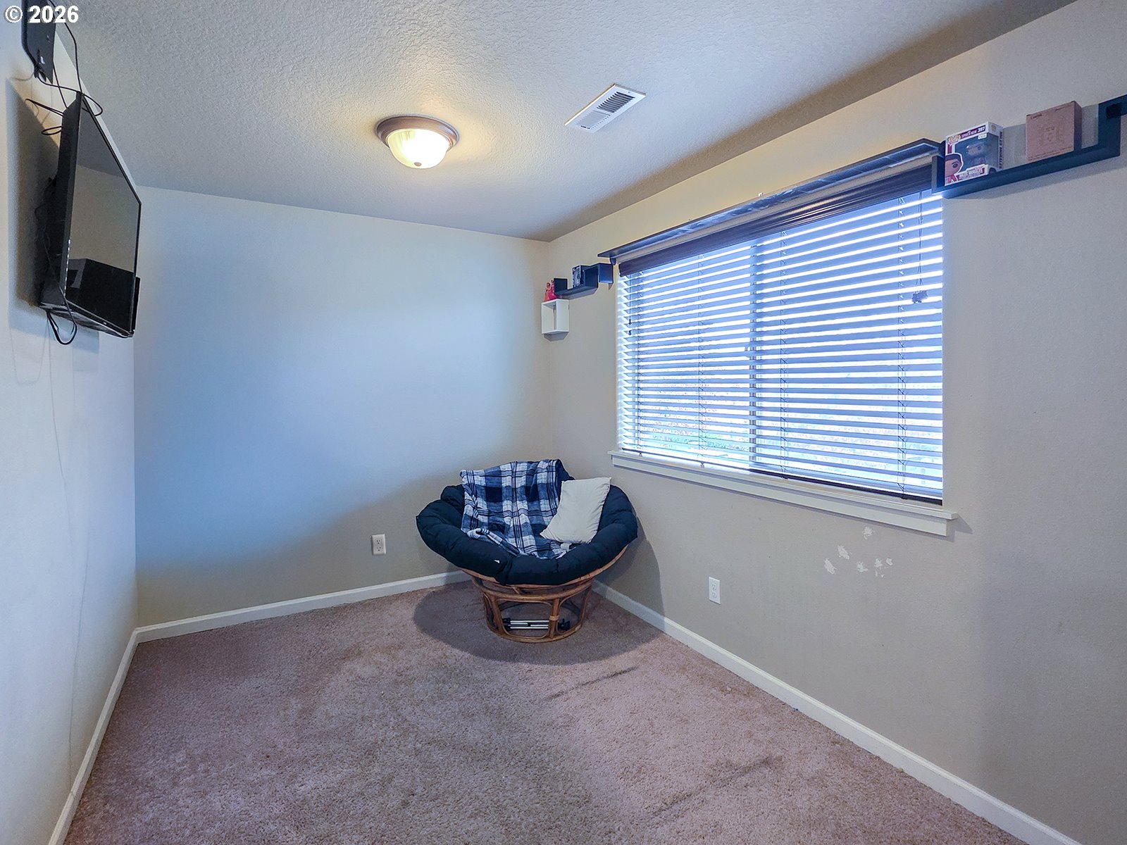2838 26th Avenue Forest Grove, OR 97116 - Photo 18 of 37 a room with a window and a flat screen tv