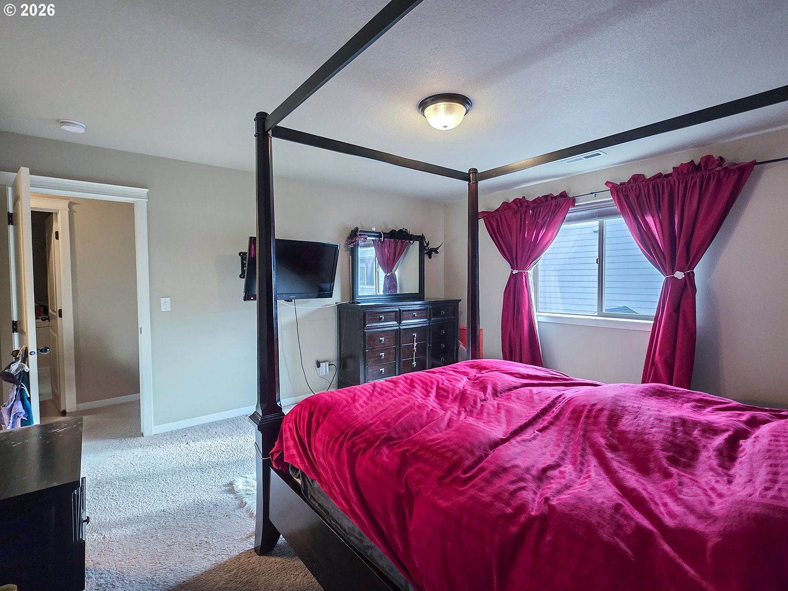 2838 26th Avenue Forest Grove, OR 97116 - Photo 22 of 37 a bed room with a bed and a flat screen tv