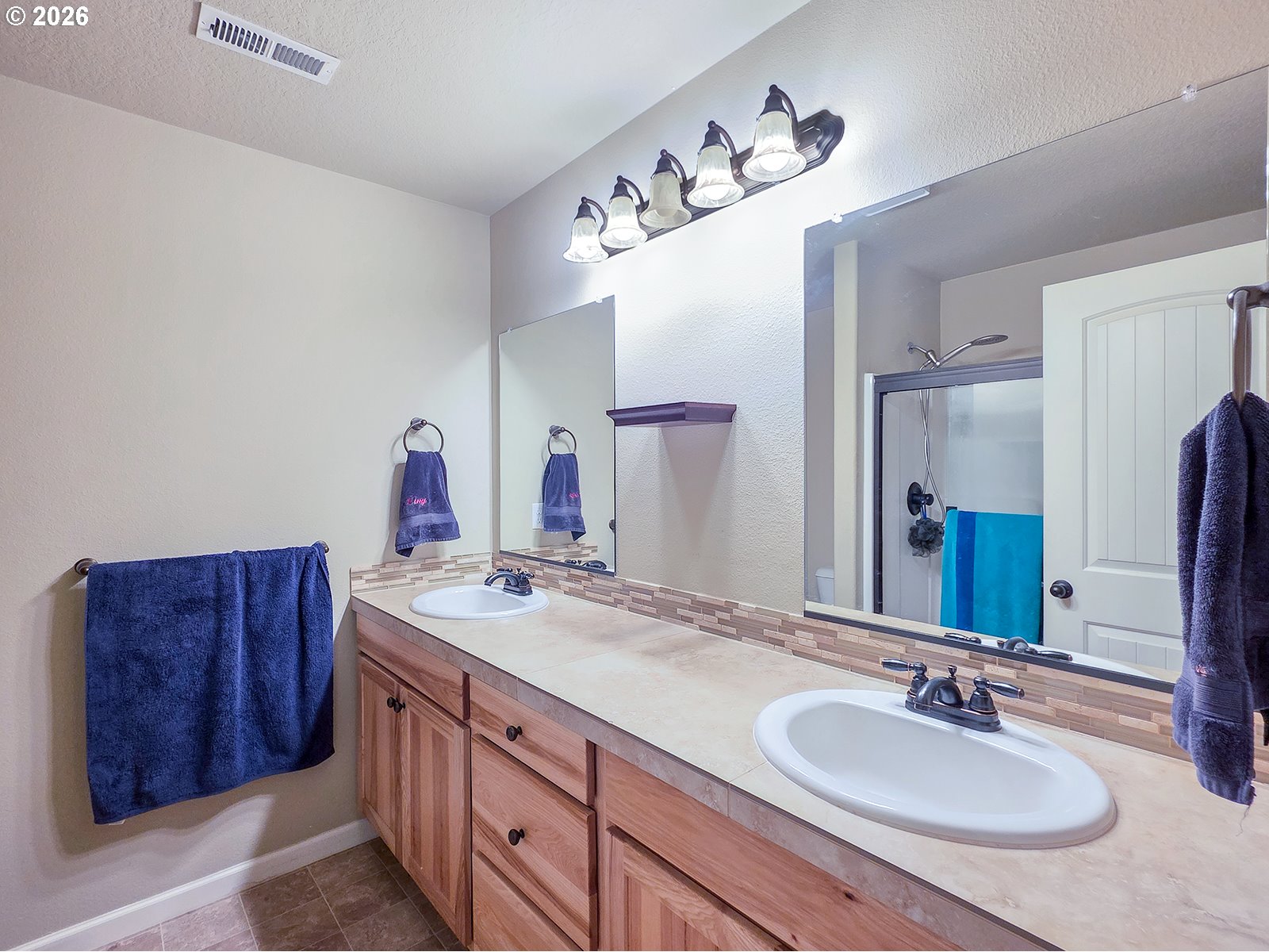 2838 26th Avenue Forest Grove, OR 97116 - Photo 23 of 37 a bathroom with a granite countertop sink and a mirror