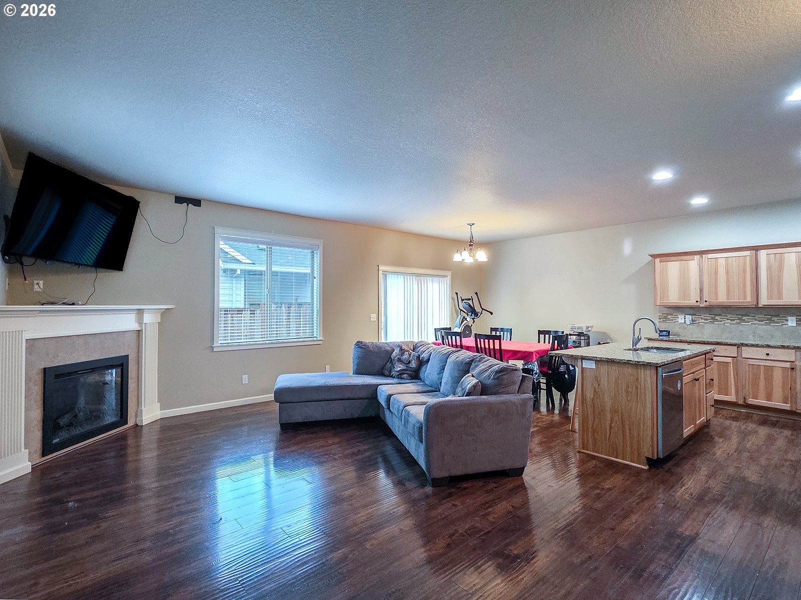 2838 26th Avenue Forest Grove, OR 97116 - Photo 3 of 37 a living room with furniture a flat screen tv and a fireplace